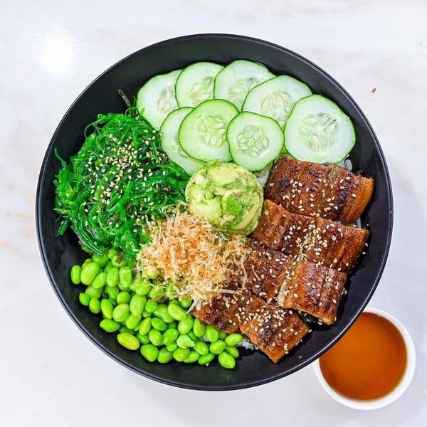 Sweetfish Poké Bowls & Sushi's eel poké bowl with seaweed, cucumbers, avocado, edamame, and sauce.